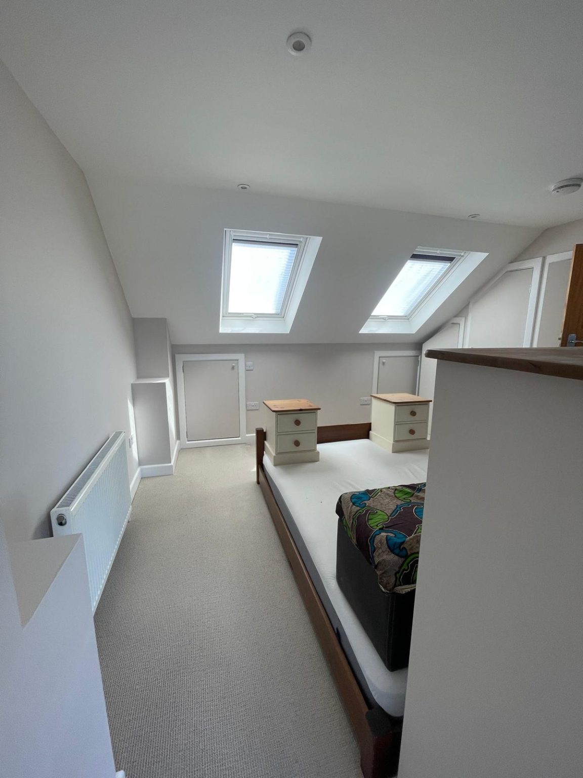 Home 47 Loft bedroom painting completed in BS6 Bristol with clean grey walls and white trim