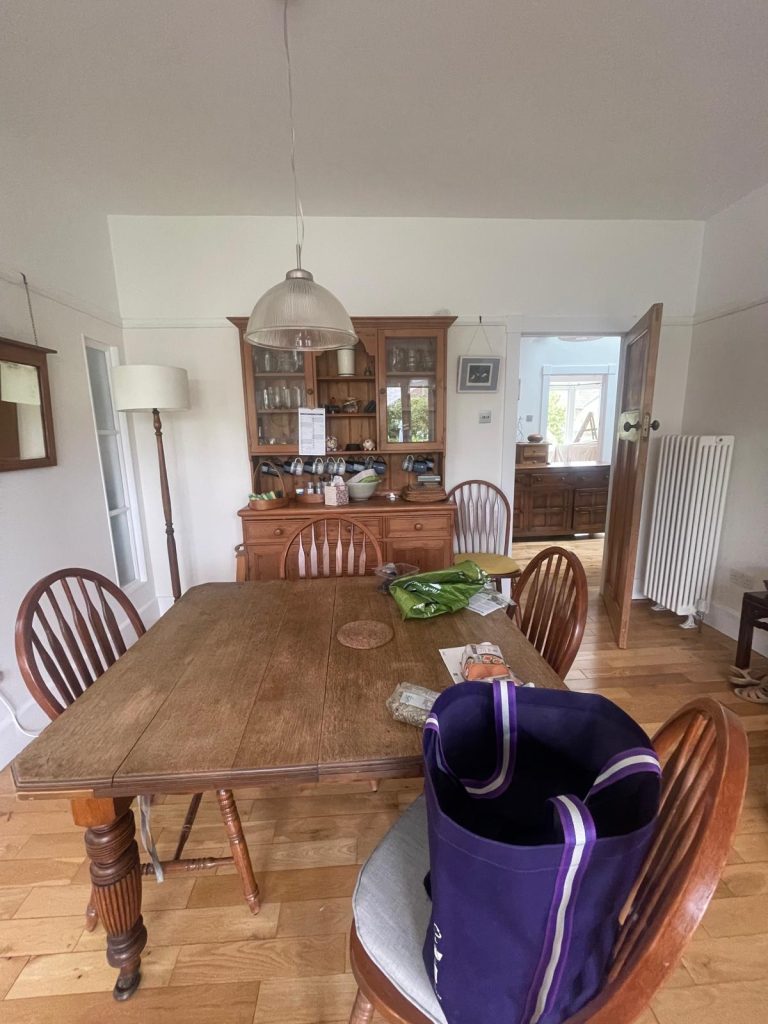 Open plan dining and living room painting in Bristol with clean neutral wall finish